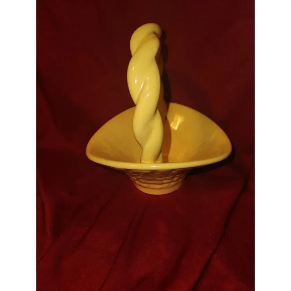 yellow ceramic basket has Leitsch on bottom